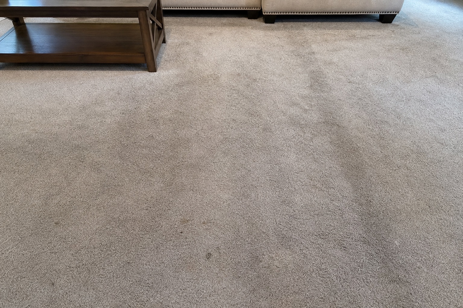 Spotted wall-to-wall carpet before professional HBM cleaning